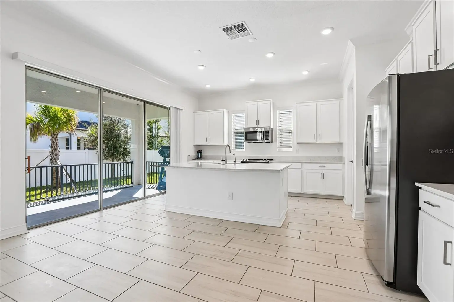 7702 S KISSIMMEE STREET, TAMPA, FL, photo 7 of 36