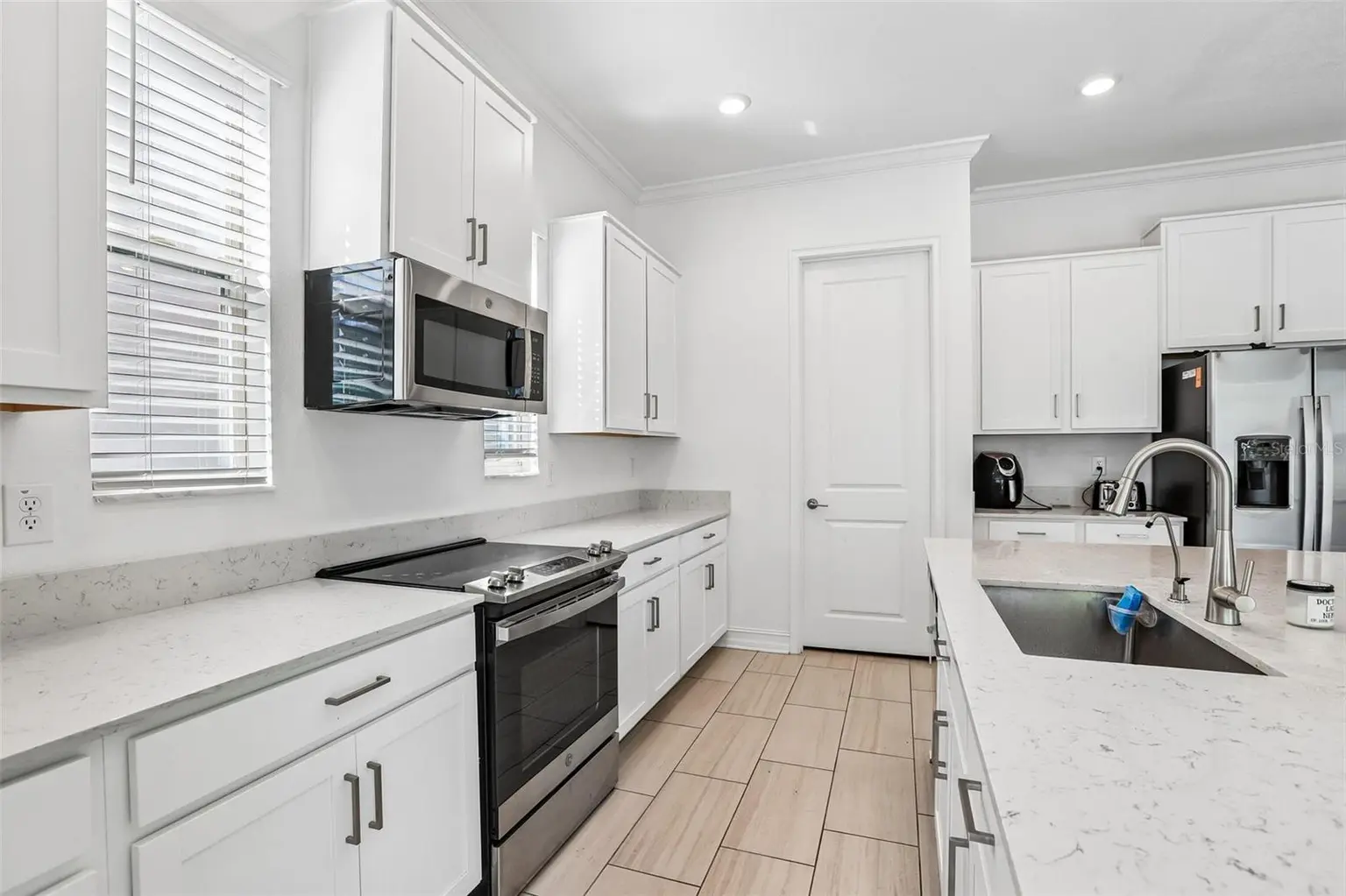 7702 S KISSIMMEE STREET, TAMPA, FL, photo 9 of 36